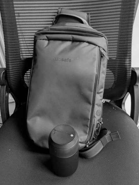 Relatively new sling bag with coffee cup