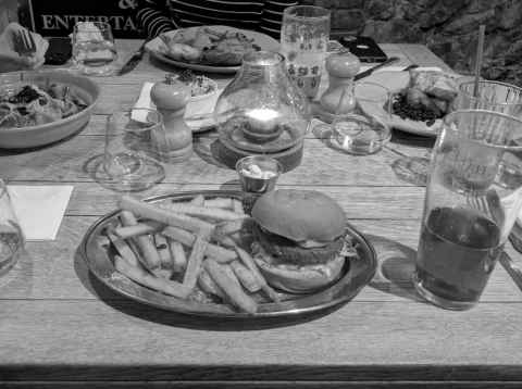 Dirty vegan burger, brioche bun, monterey jack cheese, tzatziki, pickled red onion, chipotle mayo, fries, at The Radnor Arms